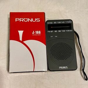New handheld portable Pronus J-166 AM/FM radio (2 AA batteries not included)